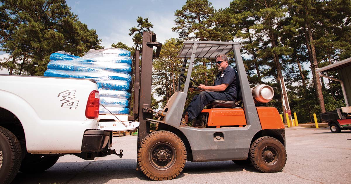 Propane Forklift Loading Supplies Into Truck in Ohio