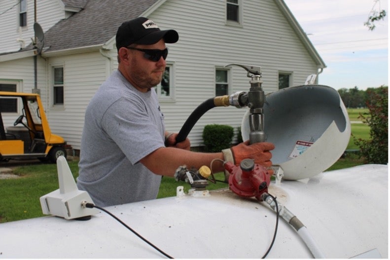 man working on tank
